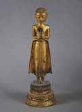 A Southeast Asian Gilt and Lacquer Figure of a Standing Buddha