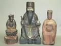 A Group of Three Chinese Carved Wood Figures of Buddha