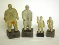 333 SET OF FOUR CARVED STONE FIGURES OF AN INUIT FAMIL