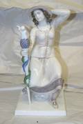 A Rosenthal Porcelain Figure of a Seated Woman
