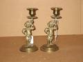 A Pair of Cast Metal Candle Sticks