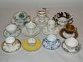 A Collection of Eleven Cabinet Cups and Saucers
