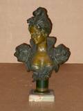 An Art Nouveau Patinated Metal Bust of a Maiden