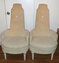 A Pair of Upholstered High Back Armchairs