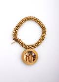 A 14 Karat Yellow Gold Single Charm Bracelet