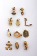 A Group of Eleven Assorted Gold Charms