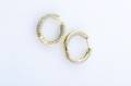 A Pair of 18 Karat Yellow Gold and Diamond Hoop Style Earrings