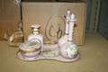 A Limoges Porcelain Five Piece Dresser Set