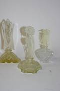 A Collection of Three Cut Glass Perfume Bottles