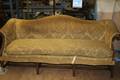 An Upholstered Camelback Sofa