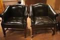 A Pair of Leather Upholstered Armchairs