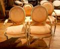 A Set of Eight Louis XVI Style Painted and Part Silvered Fauteuils
