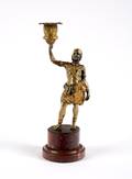 A Gilt Bronze Figural Candlestick