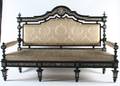 An Italian Renaissance Revival Ebonized and Ivory Inlaid Settee