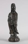 A Chinese Silver Wire Inlaid Patinated Bronze Figure of Guanyin
