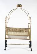 A Victorian Gilt Brass Crib