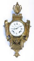 A Louis XVI Gilt Bronze Cartel Clock