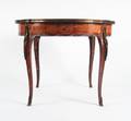 A Louis XV Style Marquetry and Gilt Metal Mounted Center Table