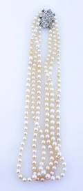 A Triple Strand Cultured Pearl Necklace