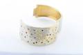 A 14 Karat Yellow Gold and Diamond Hinged Cuff Bracelet
