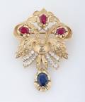 A 14 Karat Yellow Gold Diamond Ruby and Blue Sapphire Brooch