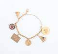 A 14 Karat Yellow Gold Charm Bracelet