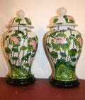A Pair of Chinese Famille Verte Baluster Form Porcelain Jars and Covers