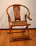 A Chinese HorseshoeBack Folding Chair