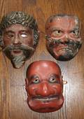 A Collection of Three Carved Wood and Polychrome Decorated Masks