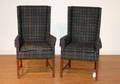 A Pair of Upholstered Wing Back Arm Chairs