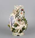 A Sitzendorf Porcelain Pierced Figural Vase