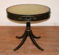 An Ebonized Drum Table