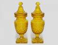 283 PAIR OF AMBER GLASS URNS AND COVERS