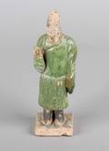 A Chinese Tang Style Pottery Figure of an Attendant