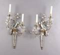 A Pair of Italian Crystal and Gilt Metal TwoLight Wall Sconces