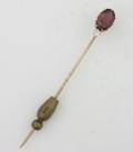 A Yellow Gold Rhodolite Garnet and Diamond Stick Pin
