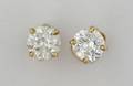 A Pair of 14 Karat Yellow Gold and Diamond Stud Style Earrings
