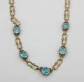A 14 Karat Yellow Gold and Blue Zircon Necklace