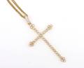 An 18 Karat Yellow Gold and Diamond Cross Pendant