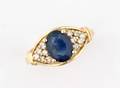A Ladys Yellow Gold Blue Sapphire and Diamond Ring