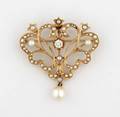 A 14 Karat Yellow Gold Seed Pearl and Diamond PendantBrooch