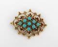 A 14 Karat Yellow Gold and Turquoise Cabochon Brooch