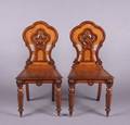 A Pair of Carved Oak Side Chairs
