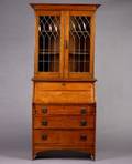 An Arts and Crafts Golden Oak Secretary Bookcase