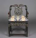 A Chinese Carved Wood Armchair