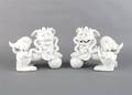 A Pair of Chinese Blanc de Chine Foo Dogs