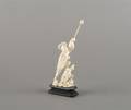 An Ivory Figure of a Man and Boy