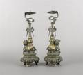 A Pair of Bronze Candle Stands