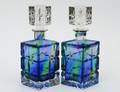 555 PAIR OF BLUE TINTED GLASS DECANTERS