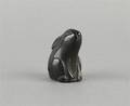 A Carved Dark Wood Netsuke
